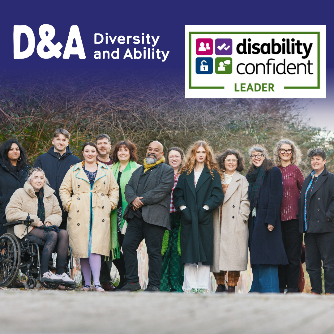 The D&A team stand outside in winter coats. At the top of the image there is the D&A logo and the Disability Confident Leader Badge.